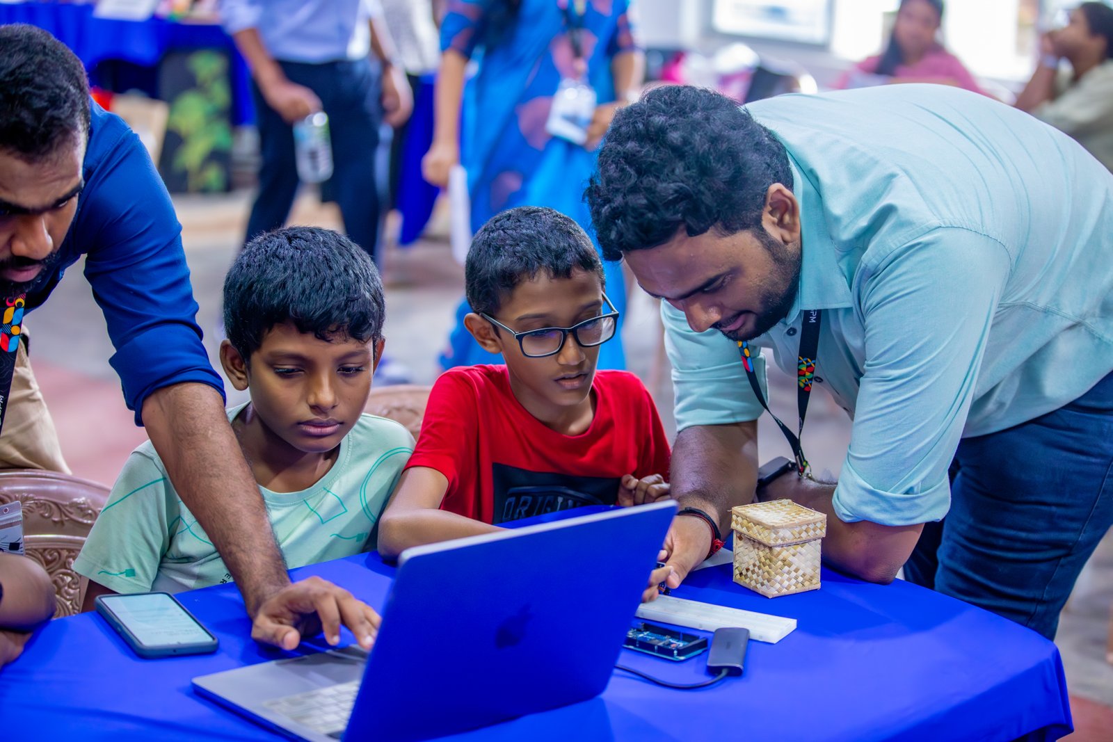 SPM Academy mentors helping students use technology